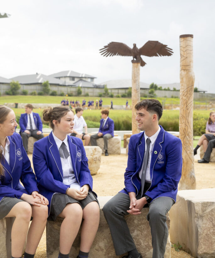 School students sitting together and talking