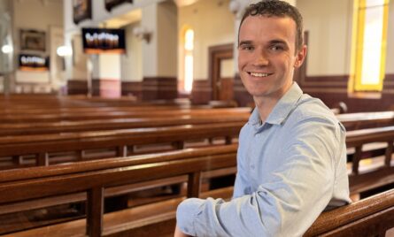30-year-old Jonathan McCallum sits in Sacred Heart Cathedral.
