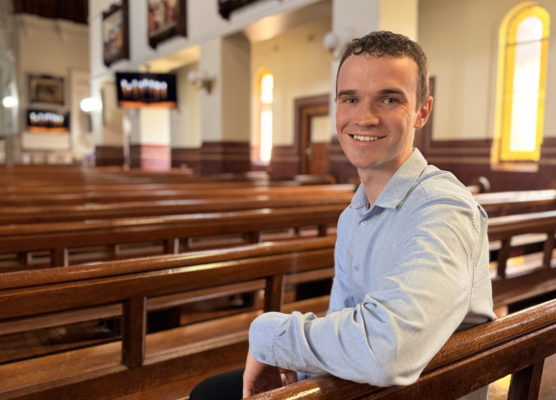 30-year-old Jonathan McCallum sits in Sacred Heart Cathedral.